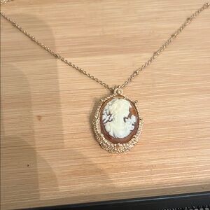 Gold and White Cameo Necklace with Ornate Frame